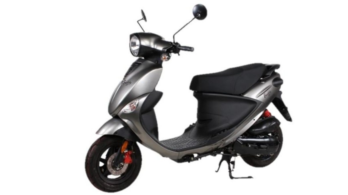 a scooter parked in front of a motorcycle