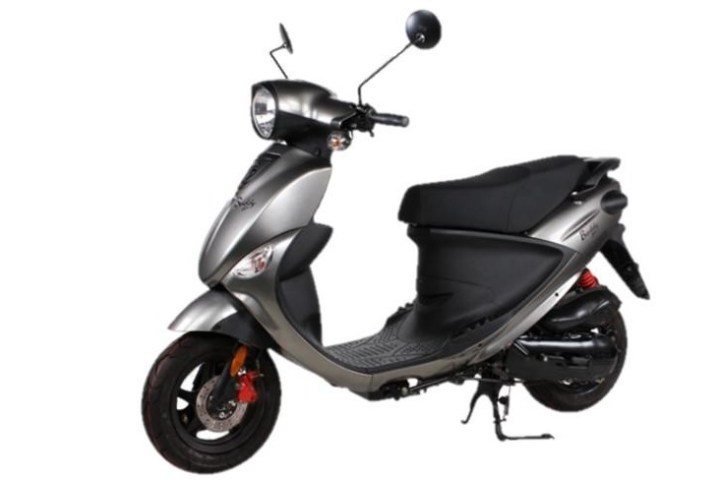 a scooter parked in front of a motorcycle